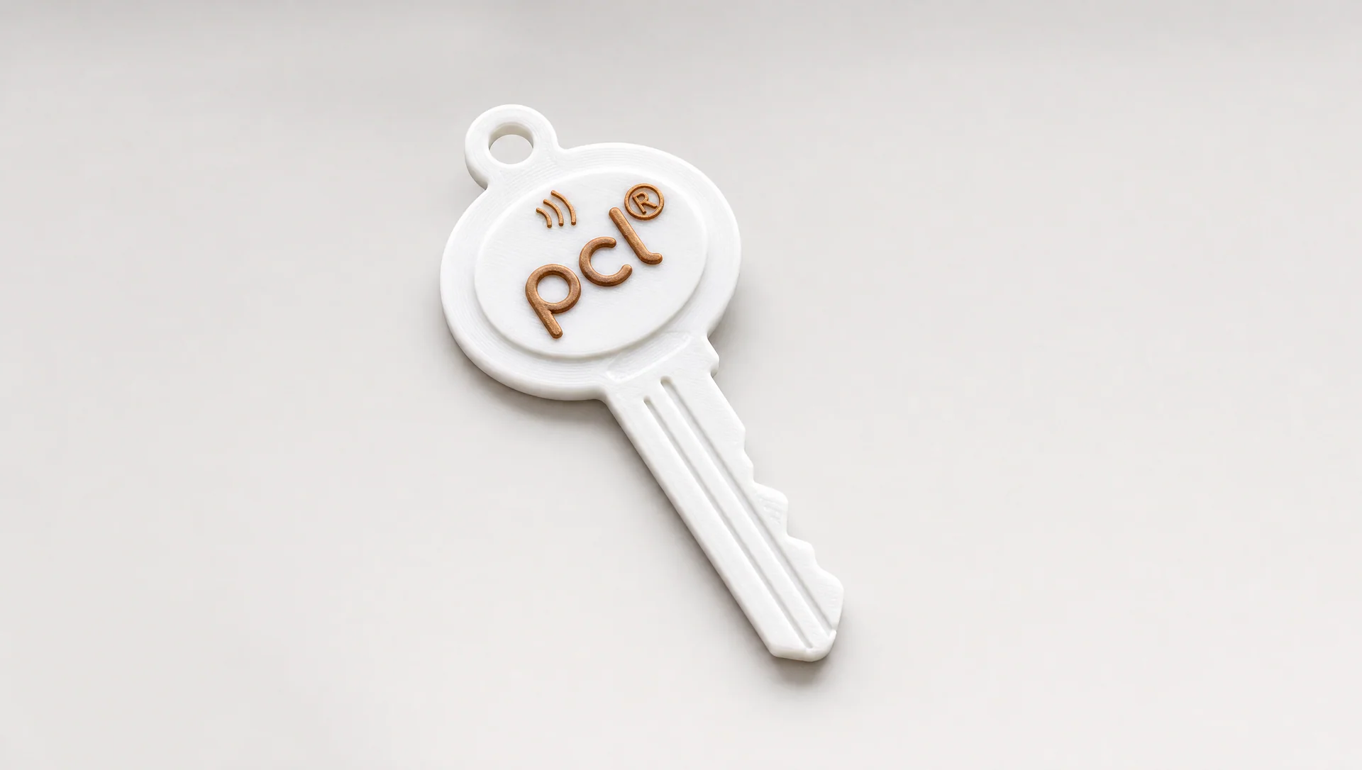White 3D-printed branded key with a copper NFC mark
