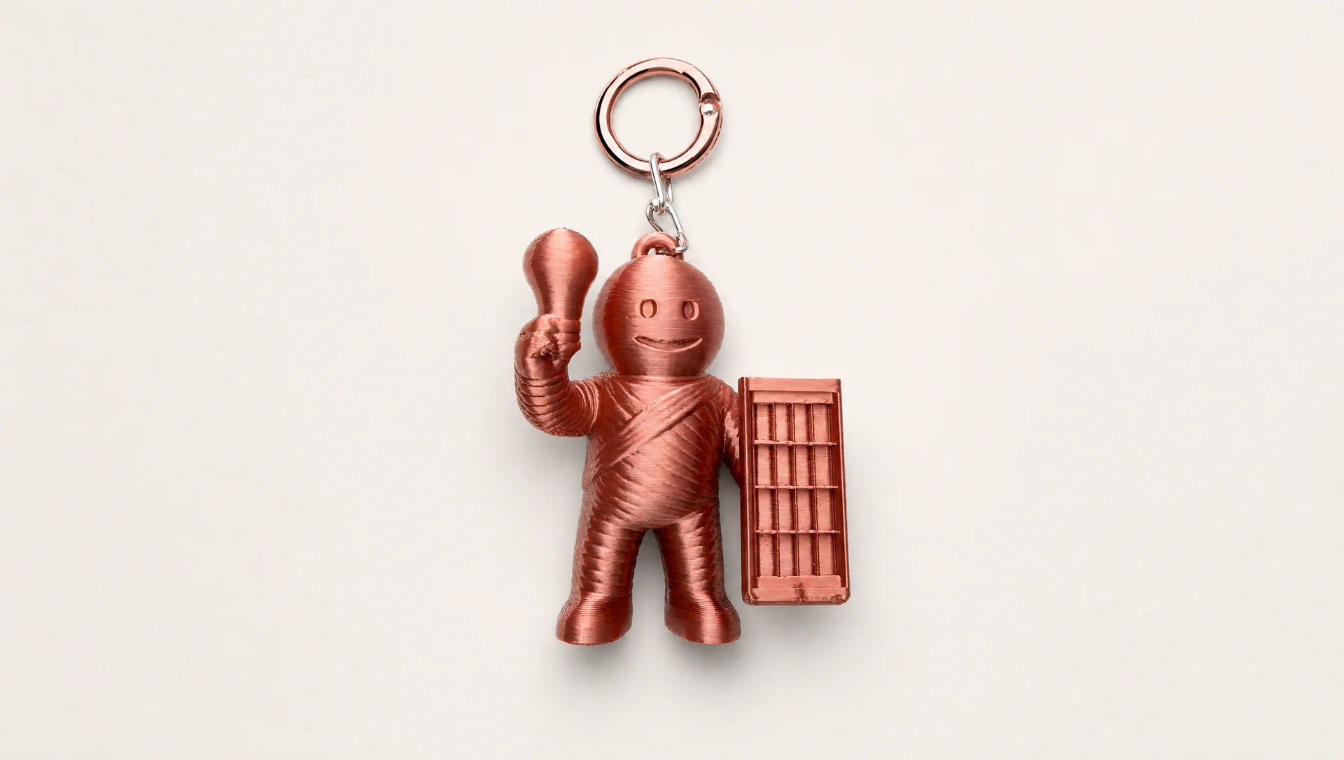 Copper 3D-printed corporate character keychain with an NFC-enabled design